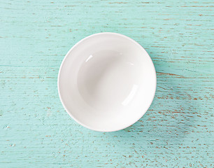 Image showing white empty bowl on blue background