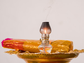 Image showing Oil lamp and joss sticks at temple in Thailand