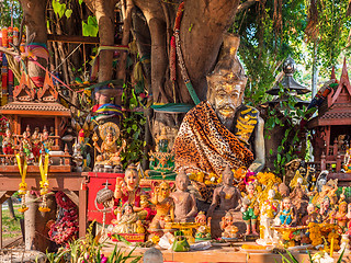 Image showing Figurines around a sacred tree in Thailand