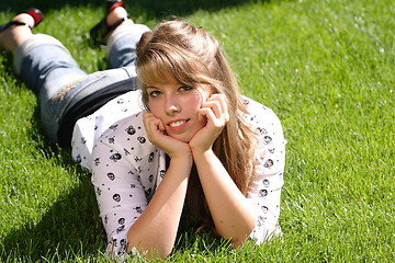 Image showing Teenage Girl Lying in the Grass