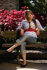 Image showing Girl Sitting on a Park Bench