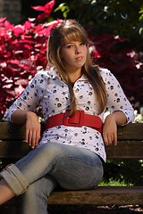 Image showing Beautiful Young Lady on a Park Bench