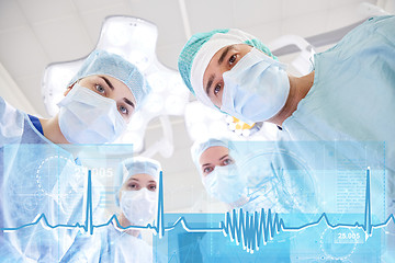 Image showing group of surgeons in operating room at hospital