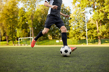 Image showing soccer player playing with ball on football field