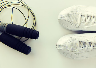 Image showing close up of sneakers and skipping rope