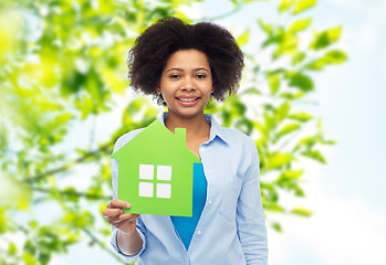 Image showing happy african american woman with green house icon