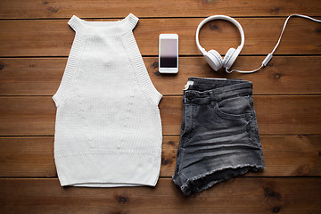 Image showing clothes and smartphone with headphones