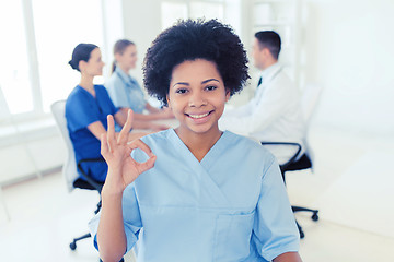 Image showing doctor or nurse showing ok hand sign at hospital