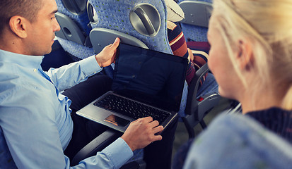 Image showing close up of passengers with laptop in travel bus