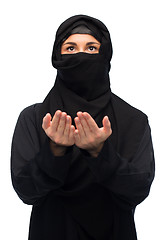 Image showing praying muslim woman in hijab over white