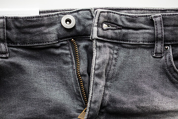 Image showing close up of denim pants or jeans with zipper