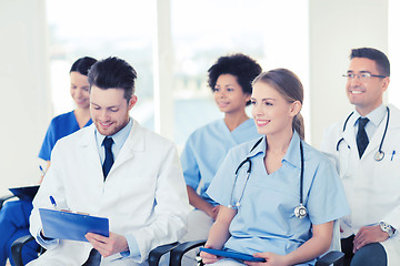 Image showing group of happy doctors on seminar at hospital