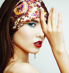 Image showing young pretty modern girl with bright shawl on head emotional posing isolated on white background, asian people ethnicity 