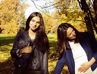 Image showing mature real mother with daughter outside autumn fall in park