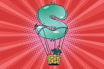 Image showing businessman in a hot air balloon dollar