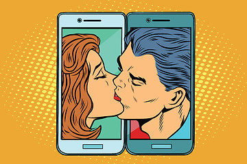 Image showing Retro man and woman kissing through a smartphone