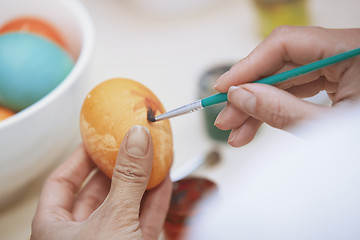 Image showing Woman preparing Easter eggs