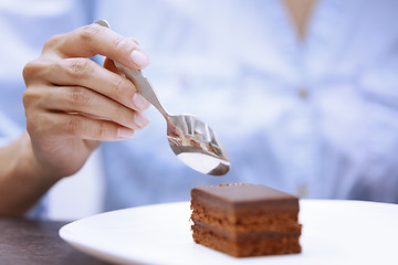 Image showing Woman eating chocolate cake