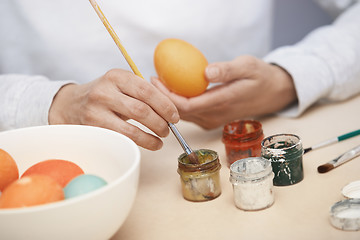 Image showing Woman preparing Easter eggs