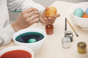 Image showing Woman preparing Easter eggs