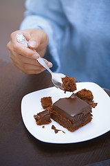 Image showing Woman eating chocolate cake 