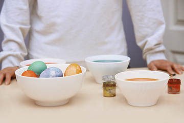 Image showing Woman preparing Easter eggs