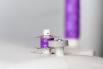 Image showing thread spools on sewing machine