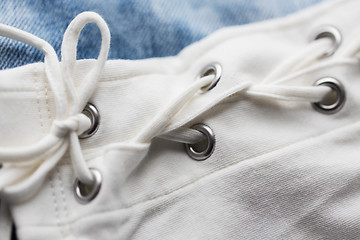 Image showing close up of lacing on clothing item