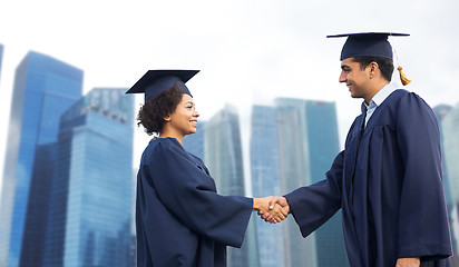 Image showing happy students or bachelors greeting each other