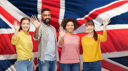 Image showing international group of happy people waving hands