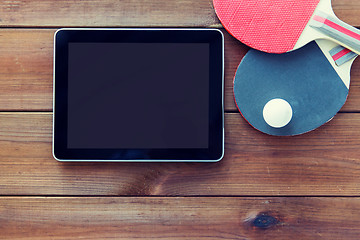 Image showing close up of table tennis rackets and tablet pc