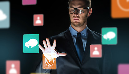 Image showing close up of businessman touching virtual screen