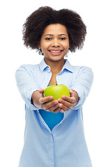 Image showing happy african american woman with green apple