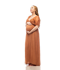 Image showing happy pregnant woman touching her big belly