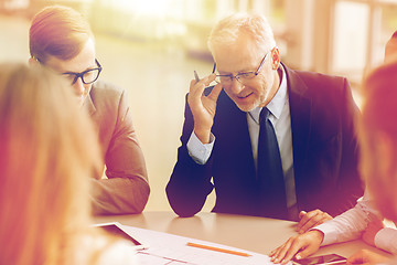 Image showing architects with tablet pc and blueprint at office