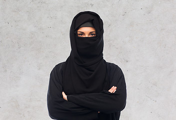 Image showing muslim woman in hijab over gray background