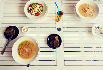 Image showing close up of pasta with tomato and cheese on plate