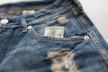 Image showing dollar money in pocket of denim pants or jeans