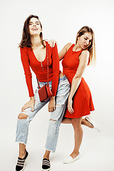 Image showing best friends teenage girls together having fun, posing emotional on white background, besties happy smiling, lifestyle people concept