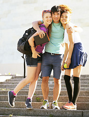 Image showing cute group of teenages at the building of university with books 