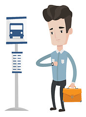 Image showing Man waiting for bus at the bus stop.