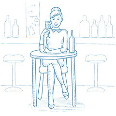 Image showing Woman drinking wine at restaurant.