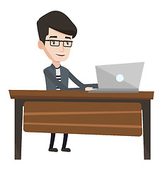 Image showing Office worker working on laptop in office.