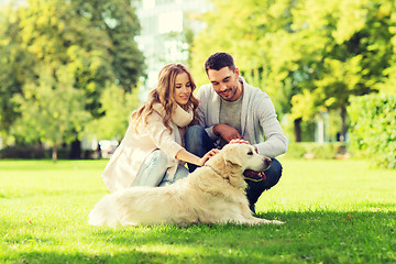 Image showing happy couple with labrador dog walking in city