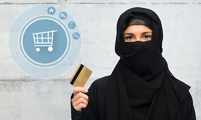 Image showing muslim woman in hijab with credit card over white