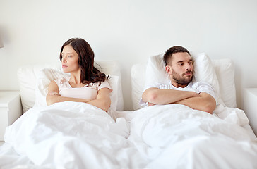 Image showing unhappy couple having conflict in bed at home