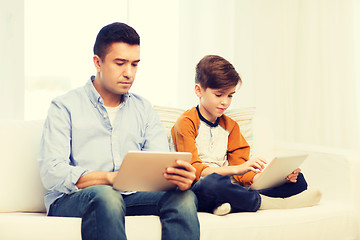 Image showing father and son with tablet pc at home