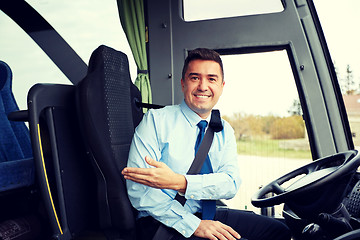 Image showing happy driver inviting on board of intercity bus