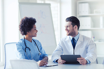 Image showing two happy doctors meeting at hospital office