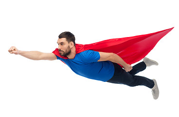 Image showing man in red superhero cape flying on air